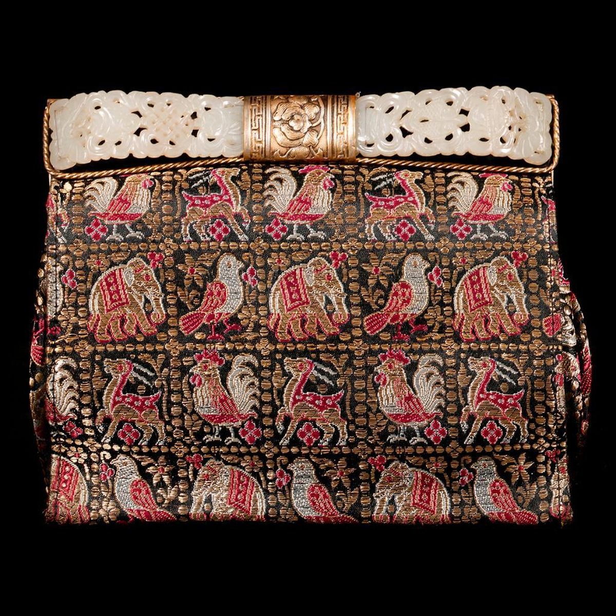 Lot 167: A Wire Mesh Purse with a 19th-Century Chinese Jade and Silver Handle, depicting various animals. Measuring 5 inches high x 6 wide in a modern presentation box.  Estimate: $2,000-3,000
