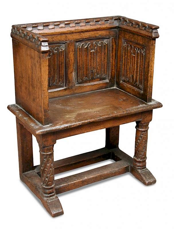 A Tudor Revival Oak Pew Seat With Castellated Crest Rail And